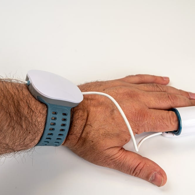 hand with pulse oxymeter on finger